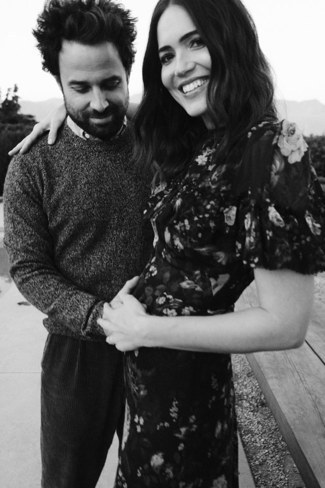 Black and white photo of Mandy Moore and Taylor Goldsmith announcing their pregnancy.