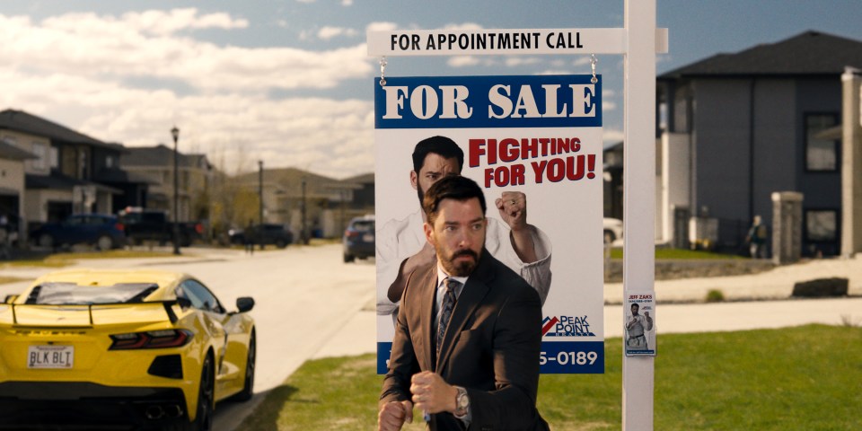 Film still of Drew Scott as Jeff Zaks in a real estate scene.