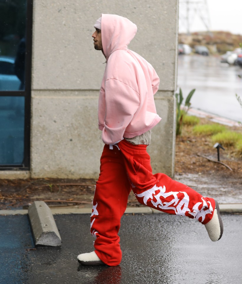 Justin Bieber running in the rain.