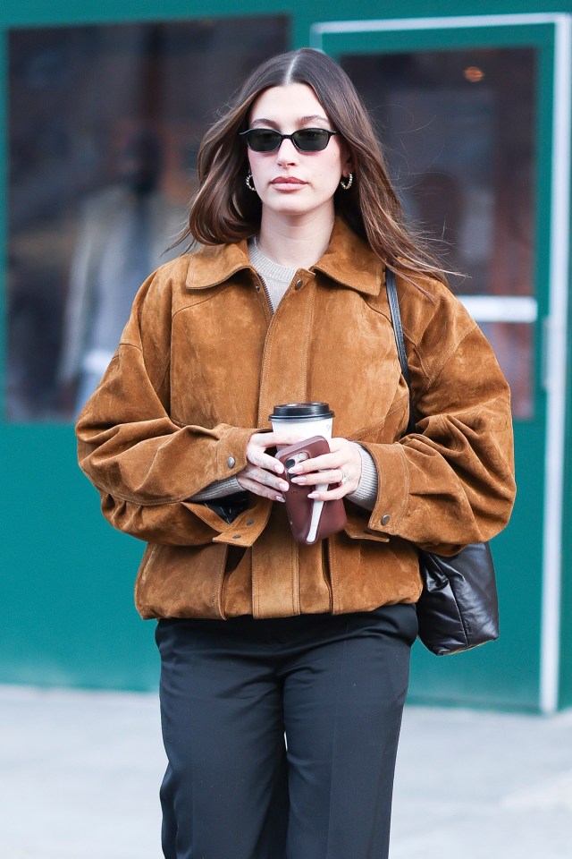 Hailey Bieber in SoHo, holding a coffee cup.