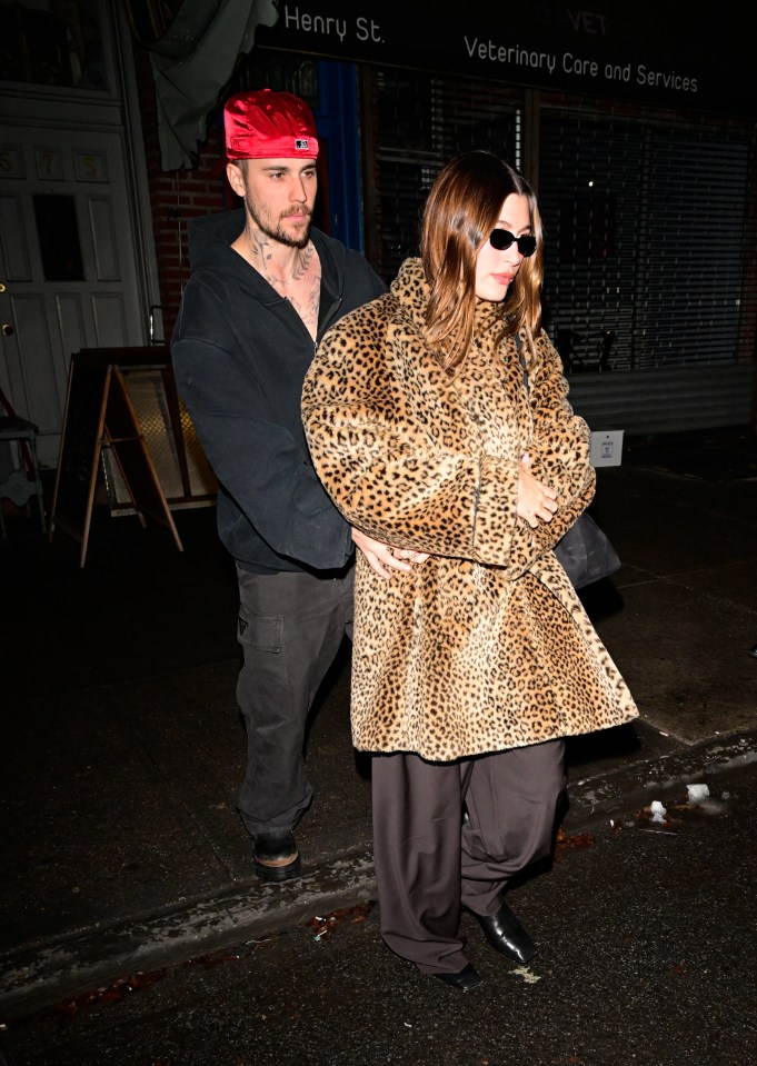 Justin Bieber and Hailey Bieber leaving a pizza restaurant.