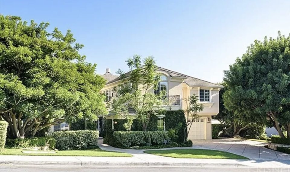 Two-story house with a large yard.