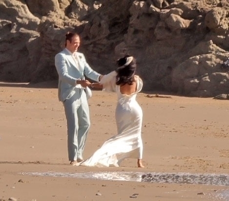 Kim Kardashian and Matthew Noszka on a beach wedding set.