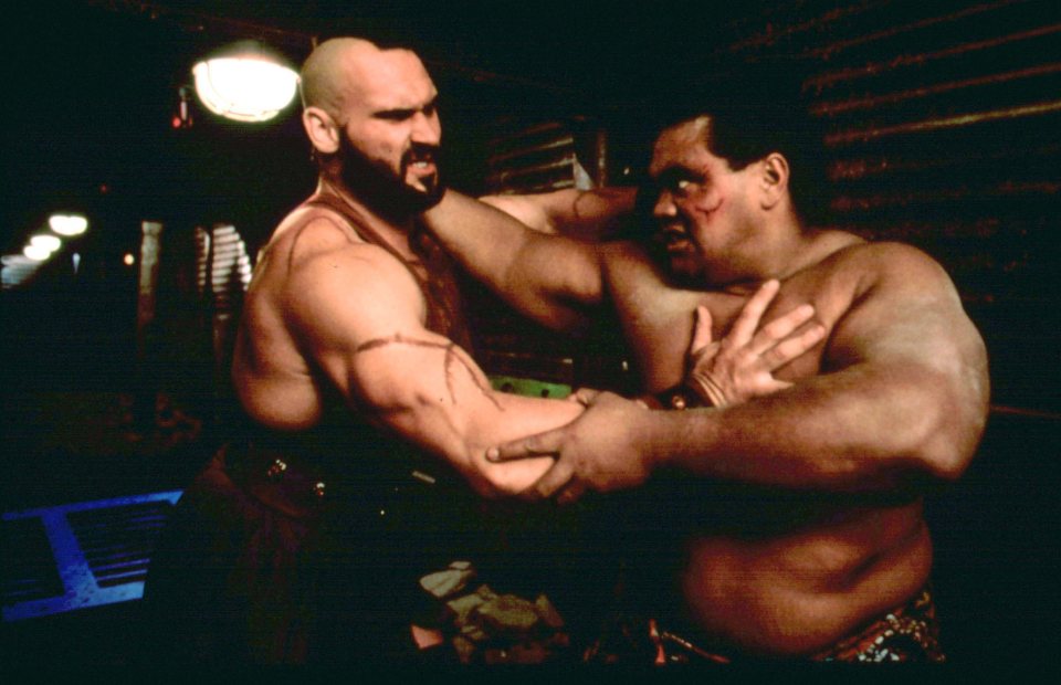 Scene from Street Fighter showing Andrew Bryniarski and Peter Navy Tuiasosopo fighting.