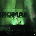 Tyler, the Creator leaps against a green background with the word "Chromakopia" in large black capital lettering