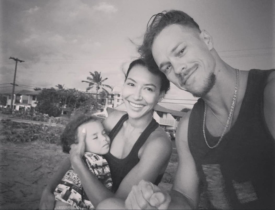 Black and white photo of Naya Rivera, Ryan Dorsey, and their son.