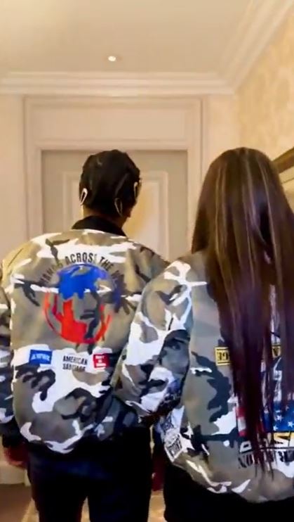 Rihanna and A$AP Rocky wearing matching camouflage jackets.