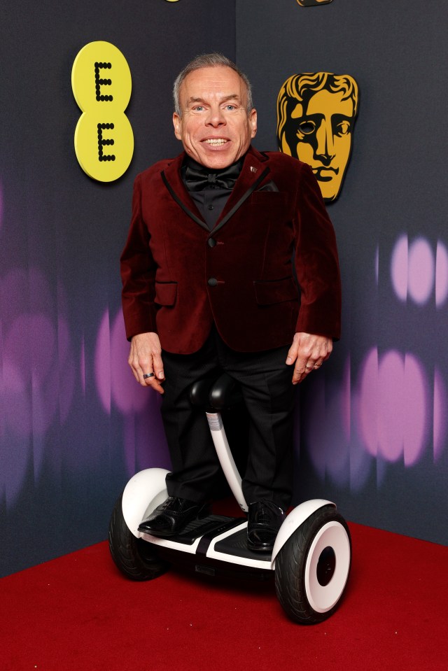 Warwick Davis on a self-balancing scooter at the EE BAFTA Film Awards.