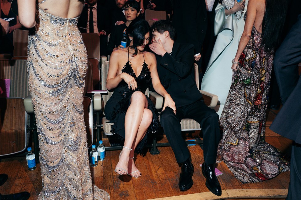 Kylie Jenner and Timothée Chalamet whispering at the EE BAFTA Film Awards.