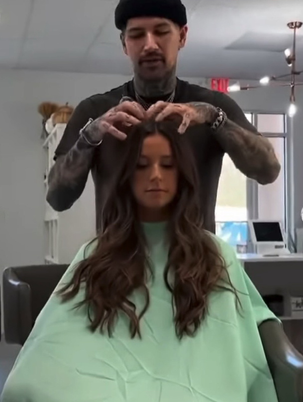 Stylist working on a woman's hair.