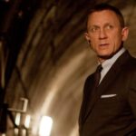 Daniel Craig in a suit inside a tunnel