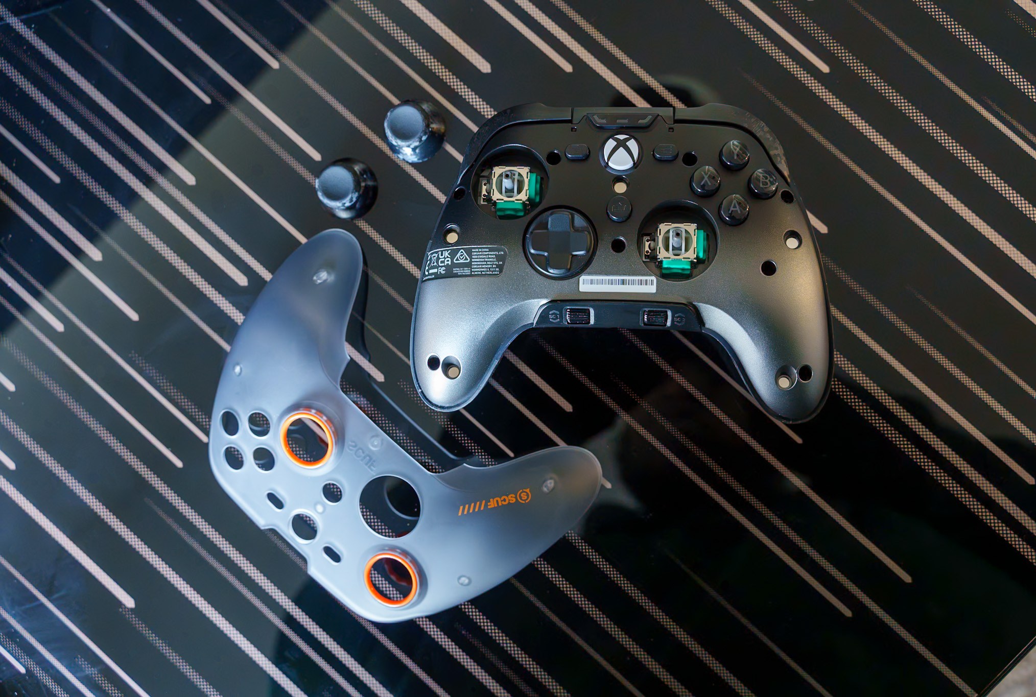 Photo of scuf valor pro xbox controller on glassy desk