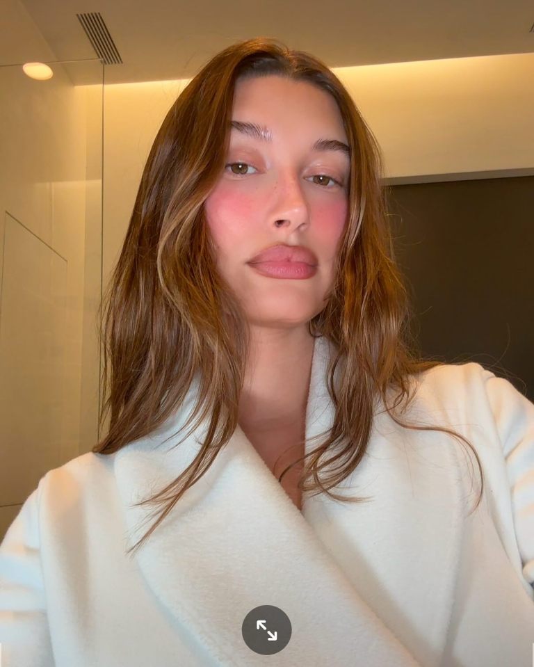 Hailey Bieber in a white robe.