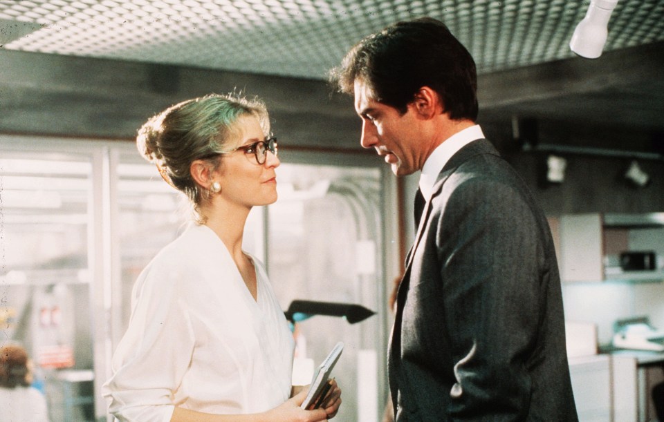 Scene still from *The Living Daylights* (1987), featuring Caroline Bliss and Timothy Dalton.