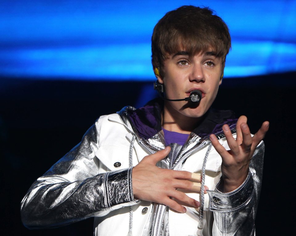 Justin Bieber performing on stage.