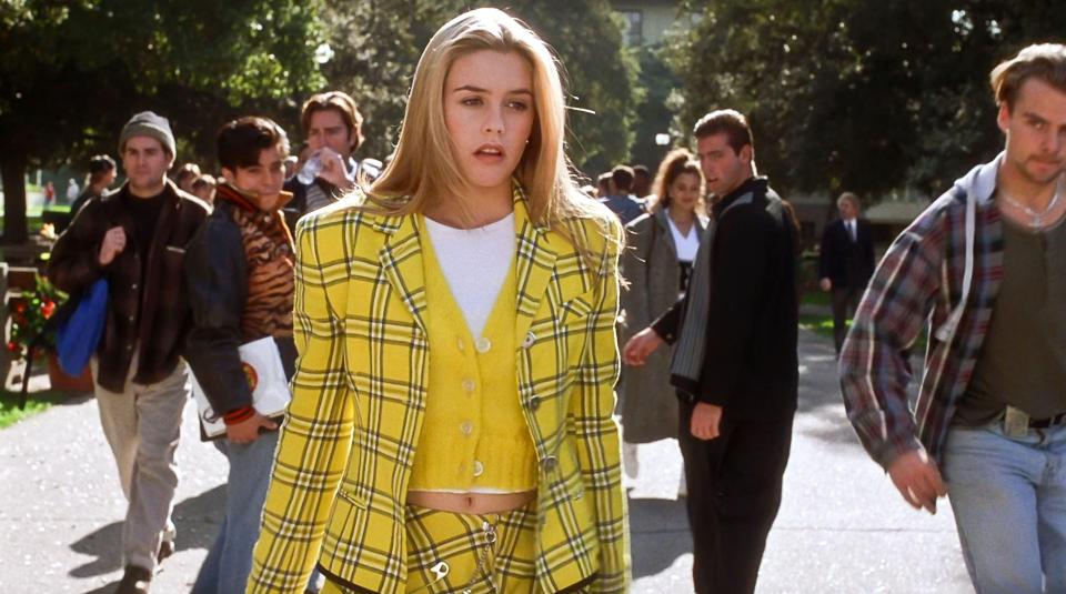 Alicia Silverstone in a yellow plaid outfit in a scene from the film *Clueless*.