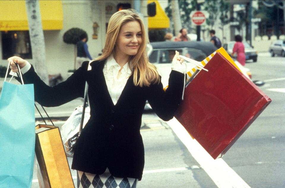 Alicia Silverstone carrying shopping bags in Clueless.