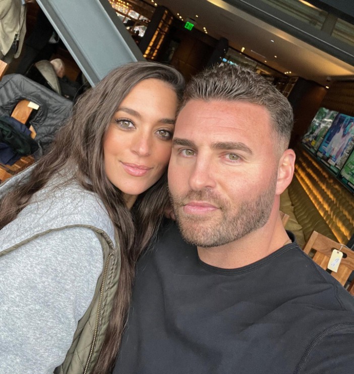 Sammi Giancola and a man posing for a selfie.