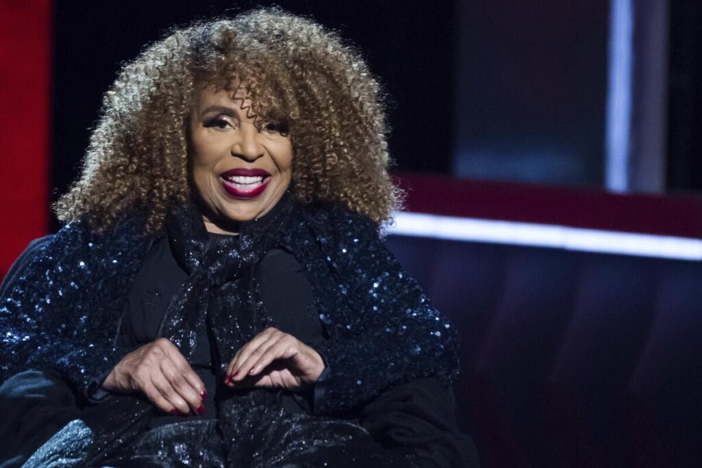 A smiling Roberta Flack wears dark sequins