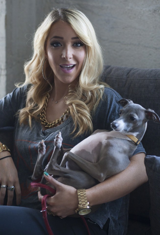 Jenna Marbles holding her dog.