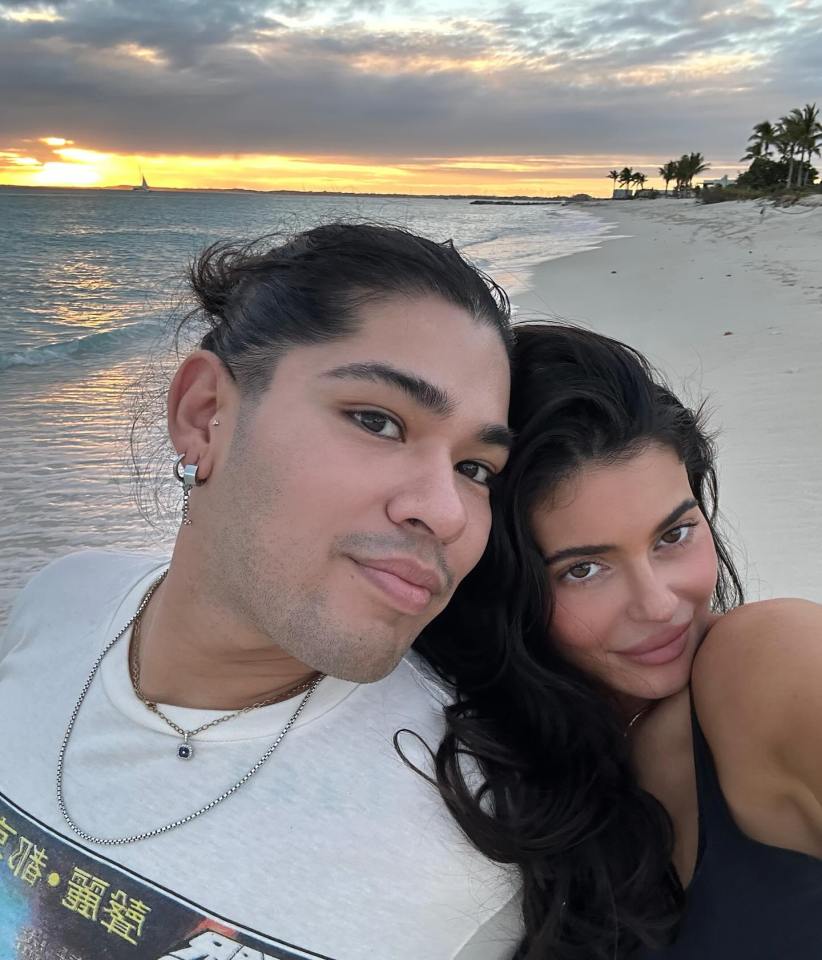 Kylie Jenner and her hairstylist on a beach at sunset.