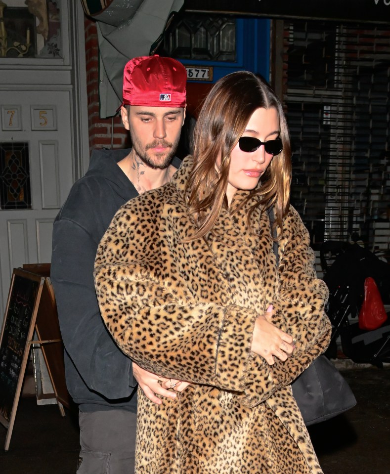 Justin Bieber and Hailey Bieber leaving a pizza restaurant.