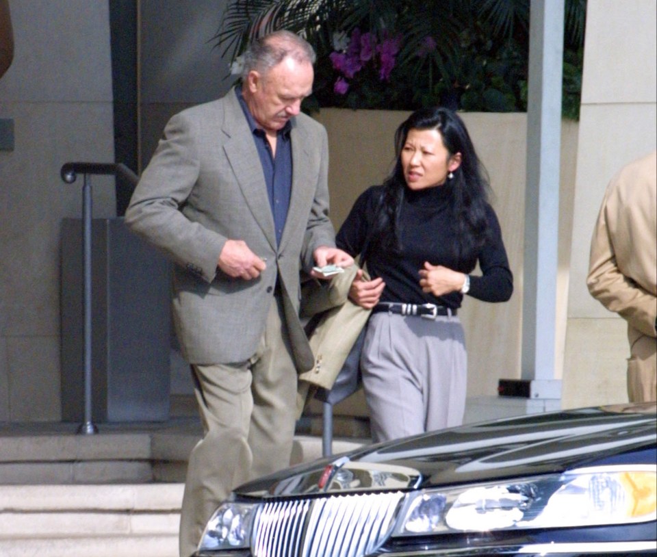 Gene Hackman and Betsy Arakawa are seen together.