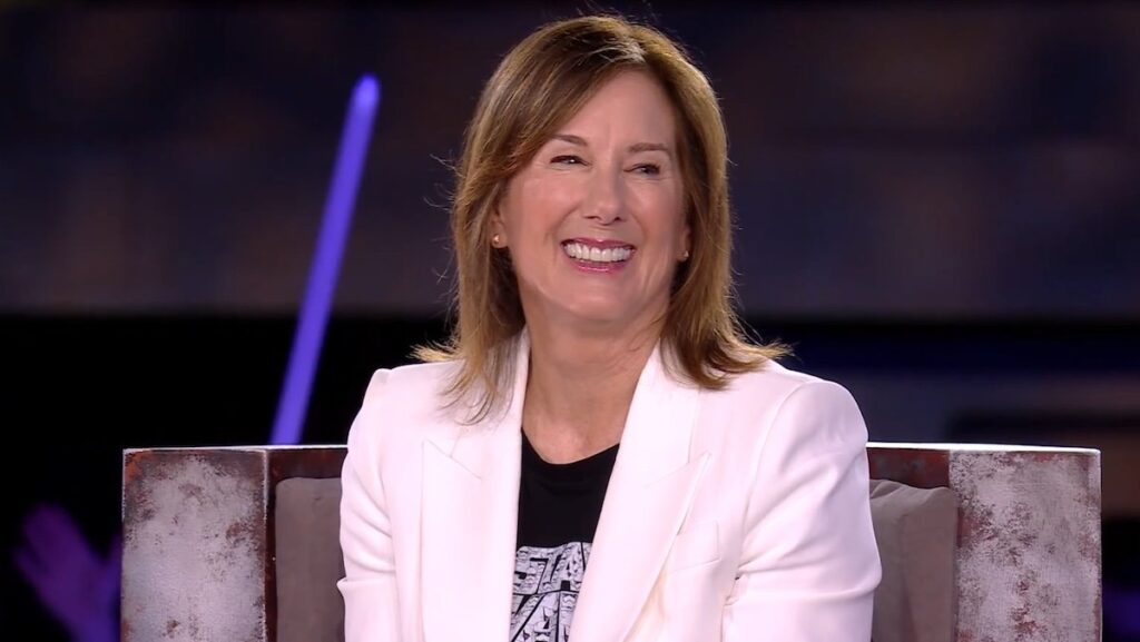 Kathleen Kennedy in a white blazer smiles