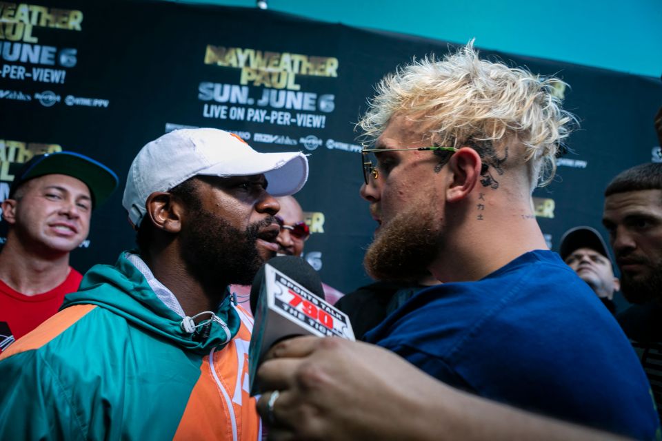 Floyd Mayweather and Jake Paul at a press conference.