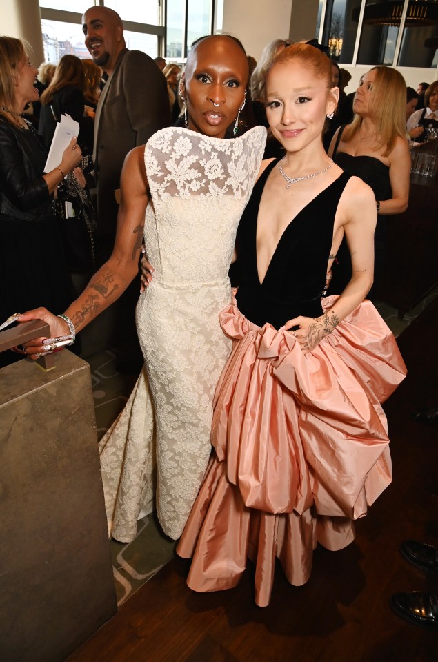 Cynthia Erivo and Ariana Grande at a champagne reception.