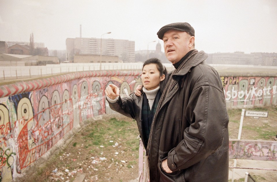 Gene Hackman and Betsy Arakawa at the Berlin Wall.