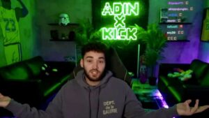 Adin Ross streams with the Kick logo in the background.