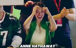 Anne Hathaway joyfully celebrating.