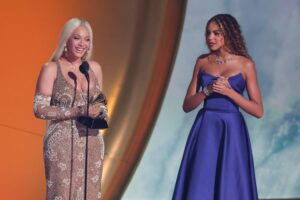 Beyoncé accepts Album of the Year for "Cowboy Carter," accompanied by daughter Blue Ivy Carter.