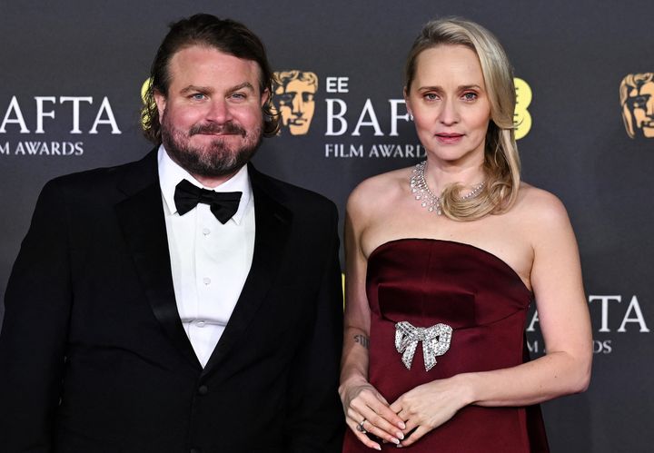 Director Brady Corbet, who said he hasn't "had a day off" since Christmas break, with his wife and creative partner, Mona Fastvold.