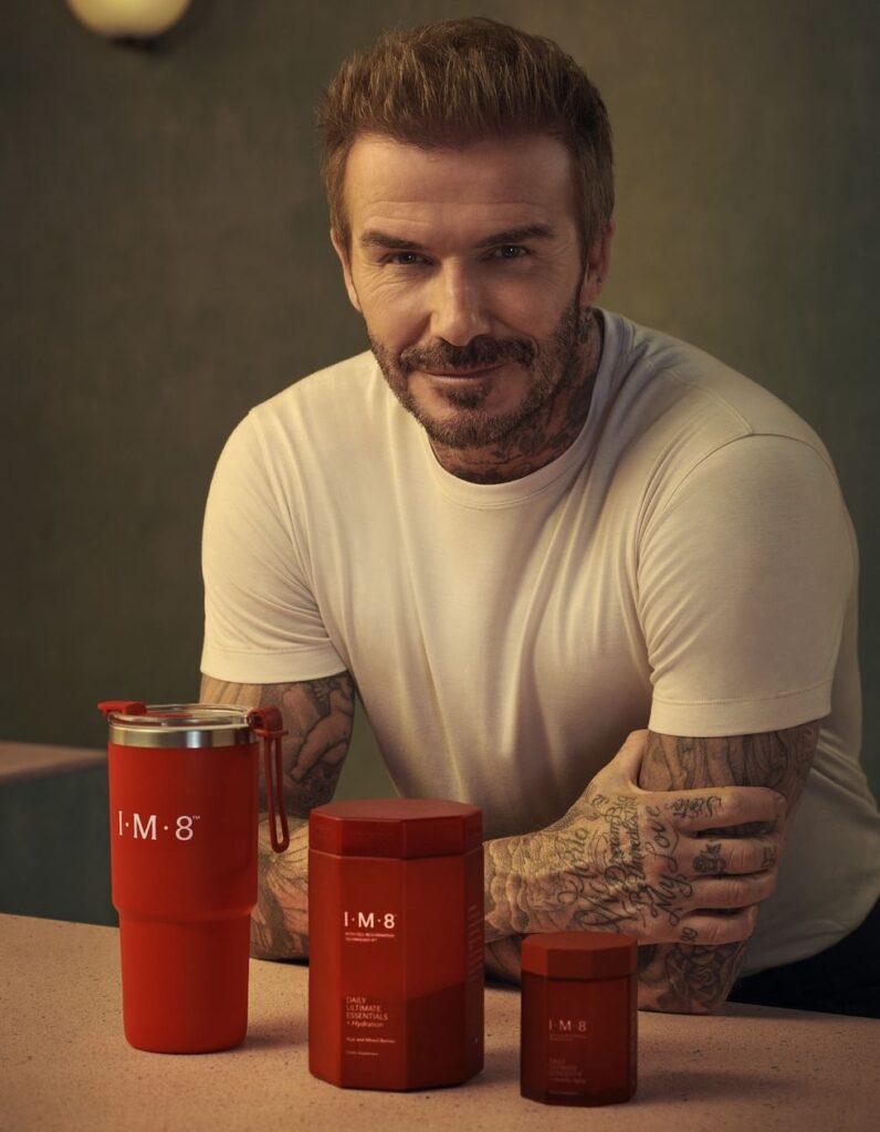 David Beckham poses with products from his supplement line, IM8 Health