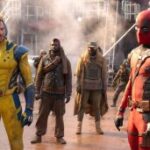 Hugh Jackman as Wolverine looks at Ryan Reynolds as Deadpool, surrounded by enemy soldiers in a scene from 'Deadpool & Wolverine'