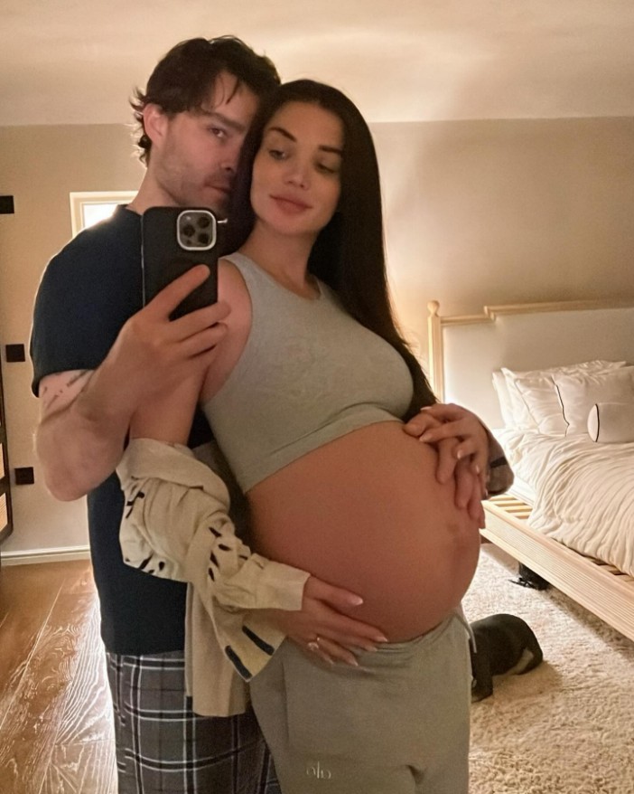 Ed Westwick poses with heavily pregnant wife Amy Jackson as she shows off huge bump in countdown to giving birth,