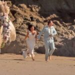 Kim Kardashian gets married on the set of the TV show "All's Fair" on the beach in Malibu. Kim and her TV groom, Matthew Noszka, ran down the beach as he picked her up, and they splashed in the water.