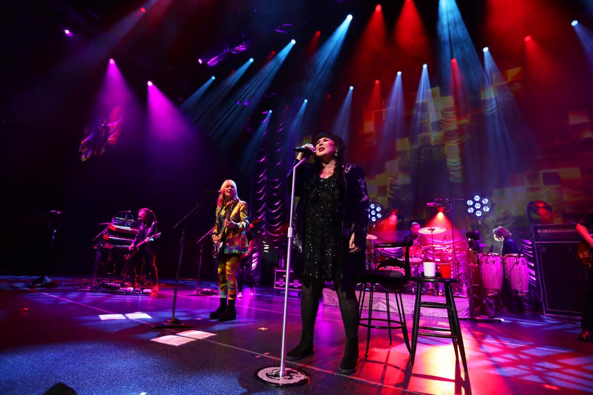 Ann Wilson, center right, and Nancy Wilson perform with Heart in Pittsburgh in May 2024.