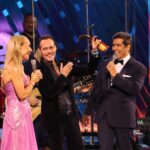 Marc Anthony shows off his award