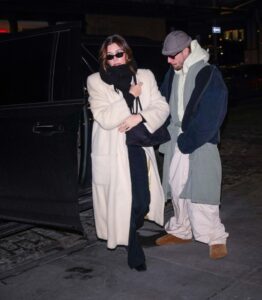 Justin and Hailey Bieber exiting a vehicle.