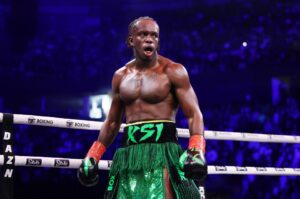 a boxer wearing a green skirt with ksi on it