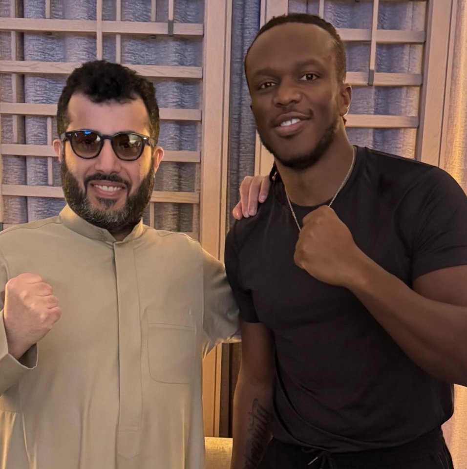 KSI and a man in a thawb posing together.