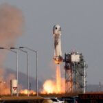 Blue Origin New Shepard rocket launching.