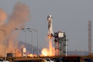 Blue Origin New Shepard rocket launching.