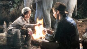 Short Round and Indy playing cards in Indiana Jones and the Temple of Doom