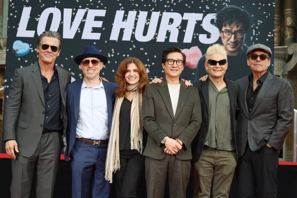 Group photo of Josh Brolin, Jeff Cohen, Kerri Green, Ke Huy Quan, Corey Feldman, and Chris Columbus at a ceremony honoring Ke Huy Quan.