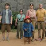 The Brown family all standing in some mysterious ruins, Paddington at the forefront in Paddington in Peru