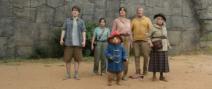 The Brown family all standing in some mysterious ruins, Paddington at the forefront in Paddington in Peru